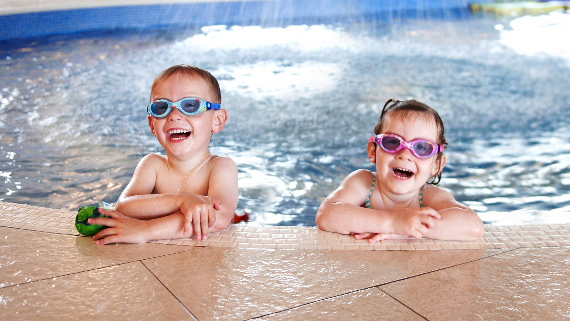 Two children enjoying Castle Royle's splash pool